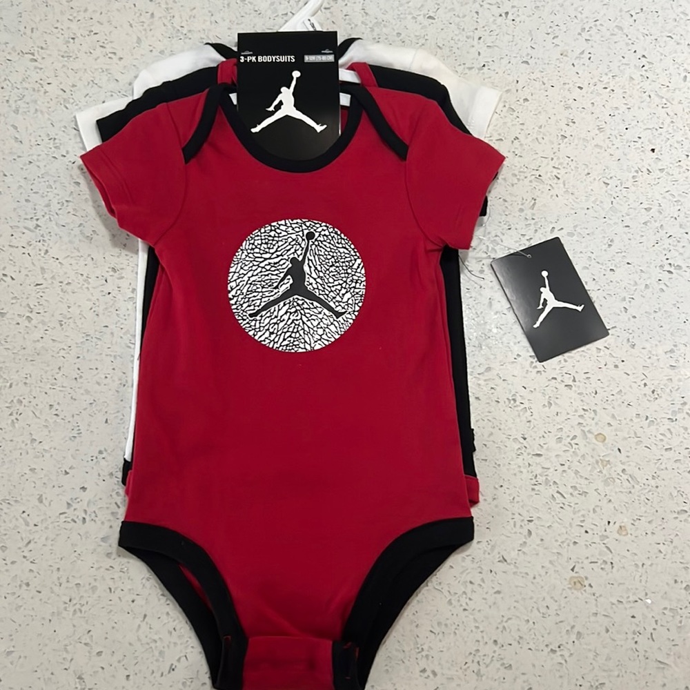 Nike baby onesies